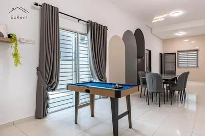 a living room with a pool table and a dining area at Black & White 4BR Semi-D Home for 10 Guests with Pool Table Games & Free Netflix WiFi in Taiping
