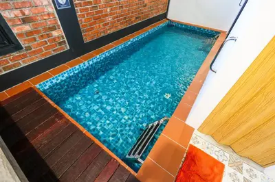 a swimming pool in the floor of a house at 35 Cozy Homestay with projector Pool BBQ evcharger in Ipoh