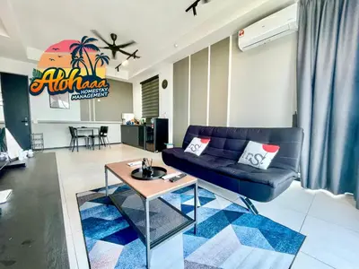 a living room with a couch and a table at Industrial Style 2 Bedroom Unit Urban Suites Georgetown Sea View Jelutong in Jelutong