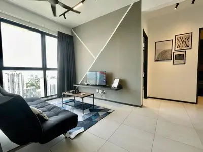 a living room with a couch and a table at Industrial Style 2 Bedroom Unit Urban Suites Georgetown Sea View Jelutong in Jelutong
