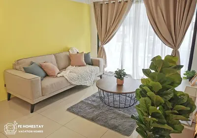 a living room with a couch and a table at FE Cozy Ipoh Homestay Manhattan Condominium Ipoh Waterpark 3BR 8 pax by FE Homestay \u6021\u4fdd\u6c11\u5bbf \u6c34\u4e0a\u4e50\u56ed in Ipoh