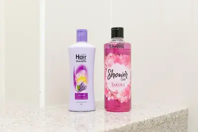 two bottles of shampoo sitting next to each other on a counter at Tanjung Bungah 5BR Villa w pool 20pax in Tanjung Bungah