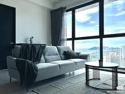 a living room with a couch and a large window at Urban Suites TWO Or THREE Bedroom Georgetown by Annesui Cottage in Jelutong