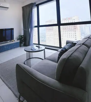 a living room with a couch and a table at Urban Suites TWO Or THREE Bedroom Georgetown by Annesui Cottage in Jelutong