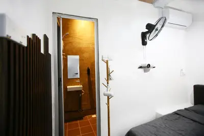 a room with a door leading to a bedroom at HangoutSpacez Queensbay at Bayan Lepas Penang in Bayan Lepas