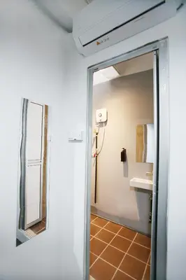 a bathroom with a mirror and a sink at HangoutSpacez Queensbay at Bayan Lepas Penang in Bayan Lepas