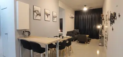 a dining room with a table and some chairs at Anderson Suite by Hopestay Property Management in Ipoh