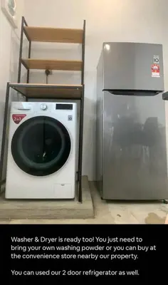a washing machine and a refrigerator in a room at Triple Room in King Queen Single Bukit Mertajam Alma in Bukit Mertajam