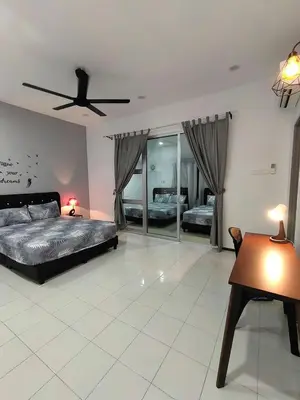 a bedroom with two beds and a ceiling fan at \u73ed\u53f0\u6c11\u5bbfNo 29 in Pantai Remis