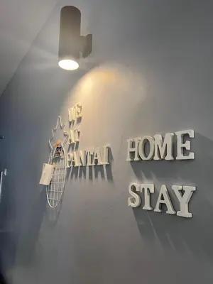 a wall with a home sign and a home stay sign at \u73ed\u53f0\u6c11\u5bbfNo 29 in Pantai Remis
