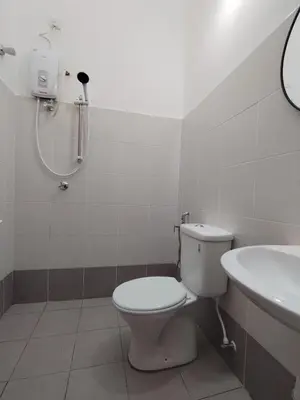 a bathroom with a toilet and a sink at Orked Homestay Seri Iskandar in Seri Iskandar