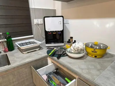 a kitchen with a counter top with a sink and a counter top at Sky Suite Meritus Residence in Perai in Perai
