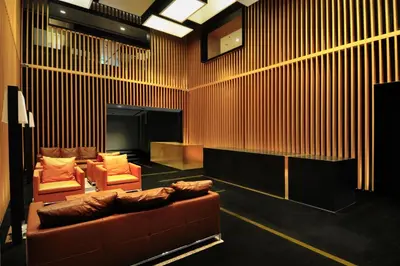 a living room with a couch and two chairs at G Hotel Kelawai in George Town