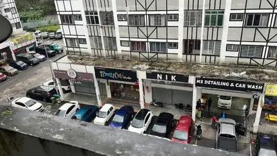 an overhead view of cars parked in a parking lot at Ayaan Cozy Homestay Cameron Highland in Tanah Rata