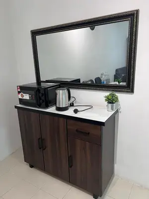 a mirror on top of a dresser in a room at Ayaan Cozy Homestay Cameron Highland in Tanah Rata