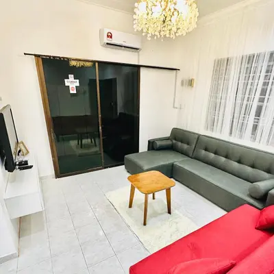a living room with a couch and a table at MayiiVip Homestay - Menglembu in Ipoh