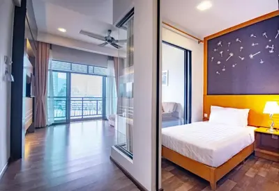 a bedroom with a bed and a large window at 16celsius at Kea Farm Brinchang in Brinchang