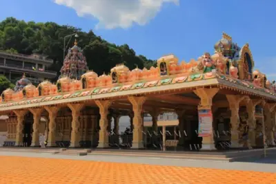 a large building with an orange roof with trees in the background at C 23 Lot 10 Pangkor Leisure Beach Studio in Pangkor