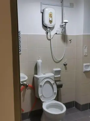 a bathroom with a toilet and a shower at 39 Lot 10 Pangkor Leisure Beach Studio in Pangkor