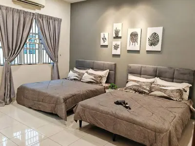 a bedroom with two beds and a window at 20-24Paxx Near Sunway Lst World wPool Tab Karaok in Ipoh