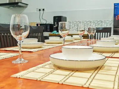 a table with plates and wine glasses on it at 20-24Paxx Near Sunway Lst World wPool Tab Karaok in Ipoh