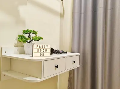 a white shelf with a potted plant on it next to a shower at 20-24Paxx Near Sunway Lst World wPool Tab Karaok in Ipoh