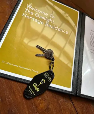 a key chain on top of a book at The Gaslight Heritage Residence - NEW in George Town