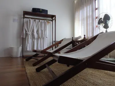 a hammock sitting in a room with a closet at The Gaslight Heritage Residence - NEW in George Town