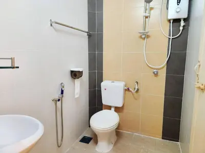 a bathroom with a toilet and a sink at 10min to IPOH town GEMILANG TAWAS 4br4bath 14pax in Ipoh