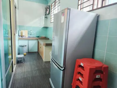 a kitchen with a refrigerator and a red stool at 10min to IPOH TOWN gunung lang 4br4bath 14 pax in Ipoh