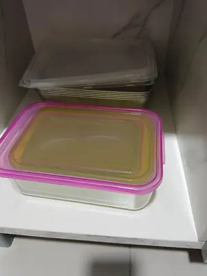 two plastic trays sitting on top of a box at Happy Homestay TheVenus Sitiawan in Sitiawan
