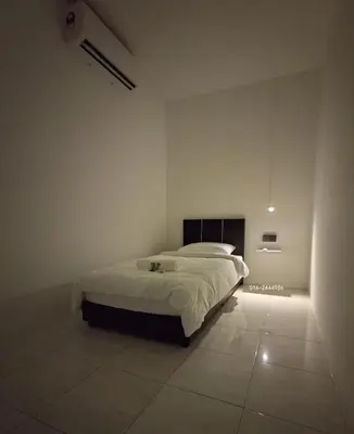 a bedroom with a bed and a tiled floor at 23 Inn Singlebed Share Bathroom No Window in Bukit Mertajam