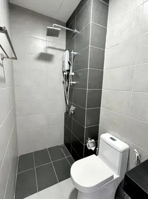 a bathroom with a toilet and a phone on the wall at URBAN Georgetown 9Pax 4QueenBed 3Bedroom 2Bath 2carparks in Jelutong