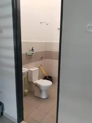 a bathroom with a toilet and a sink at Homestay Arora Teluk Intan in Teluk Intan