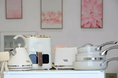 a kitchen counter with appliances on it at Comfy Cafe 43 Homestay- Holiday Home in Tanah Rata