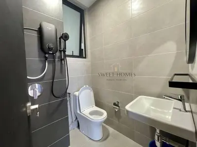 a small bathroom with a toilet and a sink at Urban Modern3BR CityView 7pax Infinity Pool in George Town