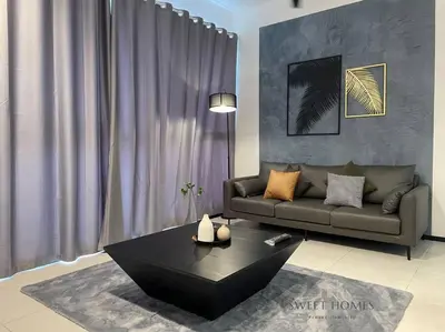 a living room with a couch and a coffee table at Urban Modern3BR CityView 7pax Infinity Pool in George Town