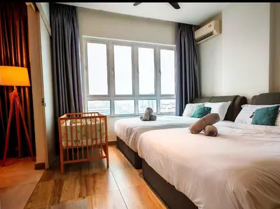 a bedroom with two beds with teddy bears on them at Ipoh Octagon Premium 7 Pax Condo One Free Parking by City Home Empire in Ipoh