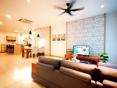 a living room with a couch and a ceiling fan at Ipoh Octagon Premium 7 Pax Condo One Free Parking by City Home Empire in Ipoh