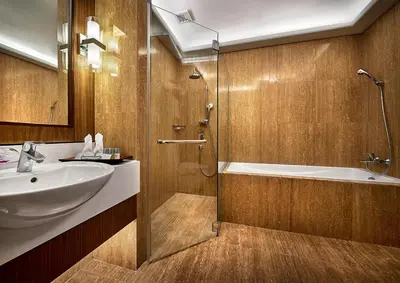 a bathroom with a sink and a tub and a shower at St Giles Wembley Penang in George Town
