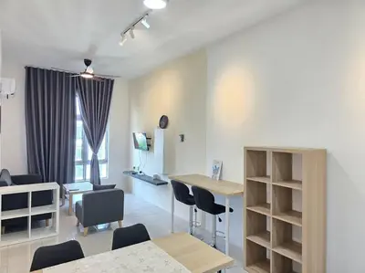 a living room with a table and chairs at Stay at Anderson Condo 161 Ipoh Town FREEWIFITVBOX in Ipoh