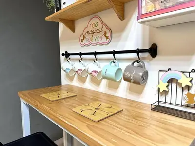 a kitchen counter with mugs on a wooden table at Unicorn Fairy Theme 2BR Airport Suite# Straits Intl# Pantai Hospt in Bayan Lepas