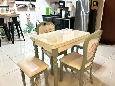a table and two chairs in a kitchen at Unicorn Fairy Theme 2BR Airport Suite# Straits Intl# Pantai Hospt in Bayan Lepas
