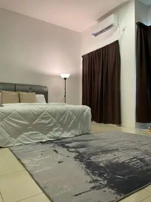 a bedroom with a bed and a window at Zara Cozy Homestay in Seri Iskandar