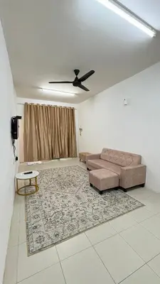 a living room with a couch and a ceiling fan at Home-Away Homestay in Gerik
