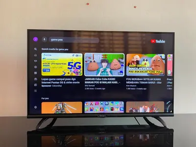 a flat screen tv sitting on top of a shelf at No 115 Homestay Tasik Raban Lenggong in Kampong Kuala Chegar
