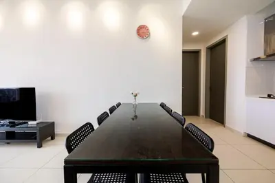 a conference room with a wooden table and chairs at Beacon Suites #Georgetown #Rooftop Pool #20 #Cozy in George Town