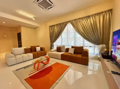 a living room with two couches and a tv at Happiness Stay 20pax Karaoke & Snooker in Ipoh
