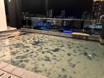 a swimming pool on the roof of a building at World Class Apartment In Georgetown 3BR in Jelutong