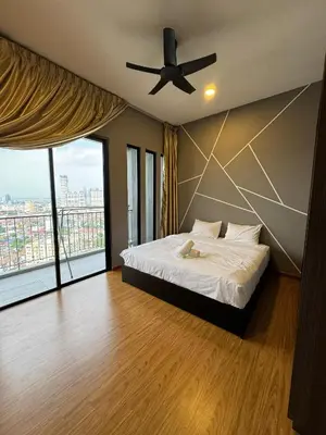 a bedroom with a bed and a ceiling fan at Cozy Comfort- Beacon Executives Suite in George Town